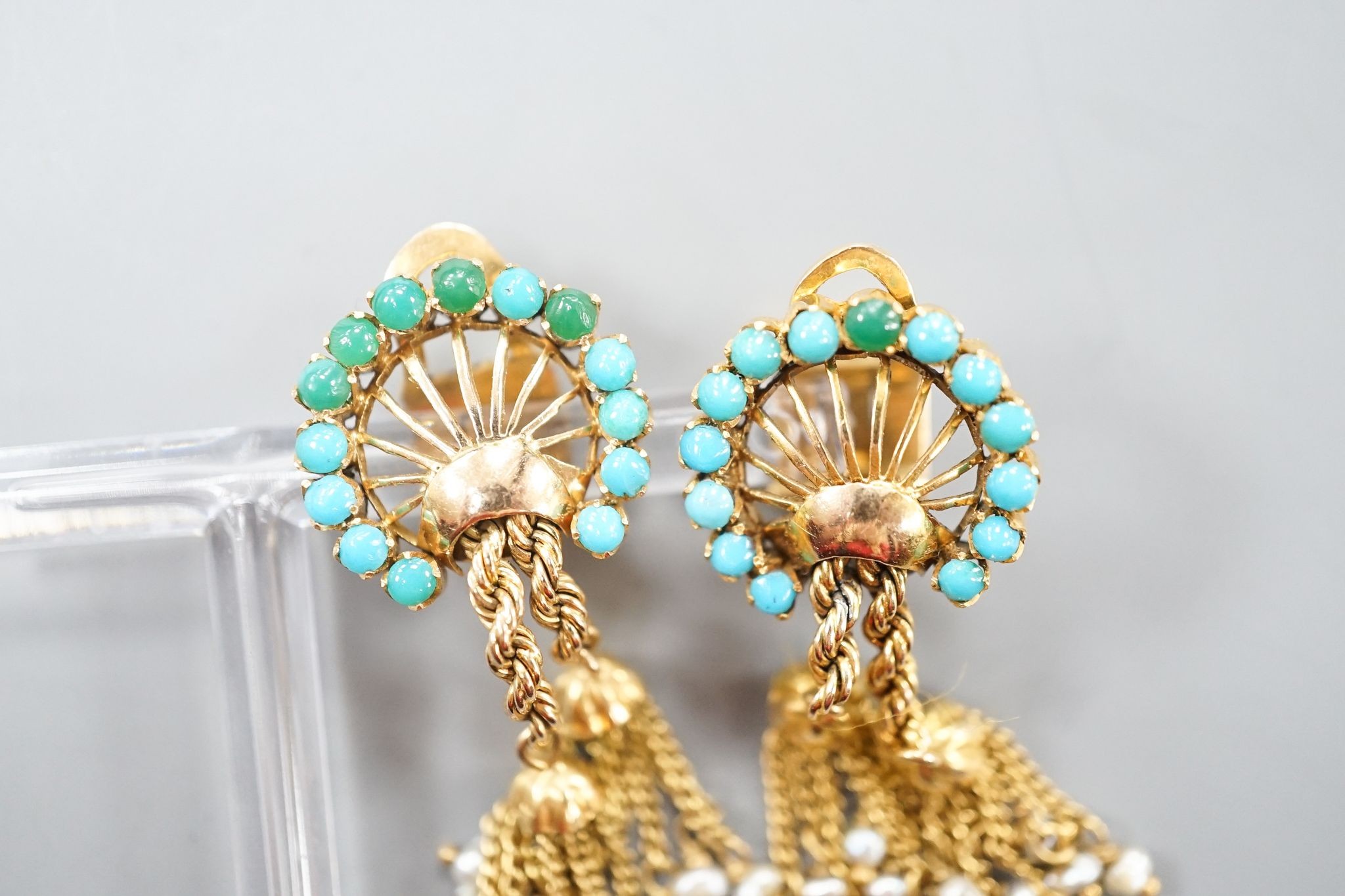 A pair of 20th century Middle Eastern yellow metal, seed pearl and turquoise set tassel drop ear clips, 47mm, gross weight 12.5 grams.